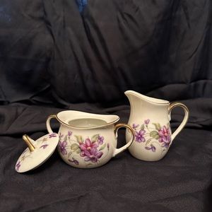 Royal sealy covered sugar bowl and creamer.